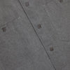 Close-up of a gray shirt with button details