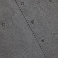 Close-up of a gray shirt with button details