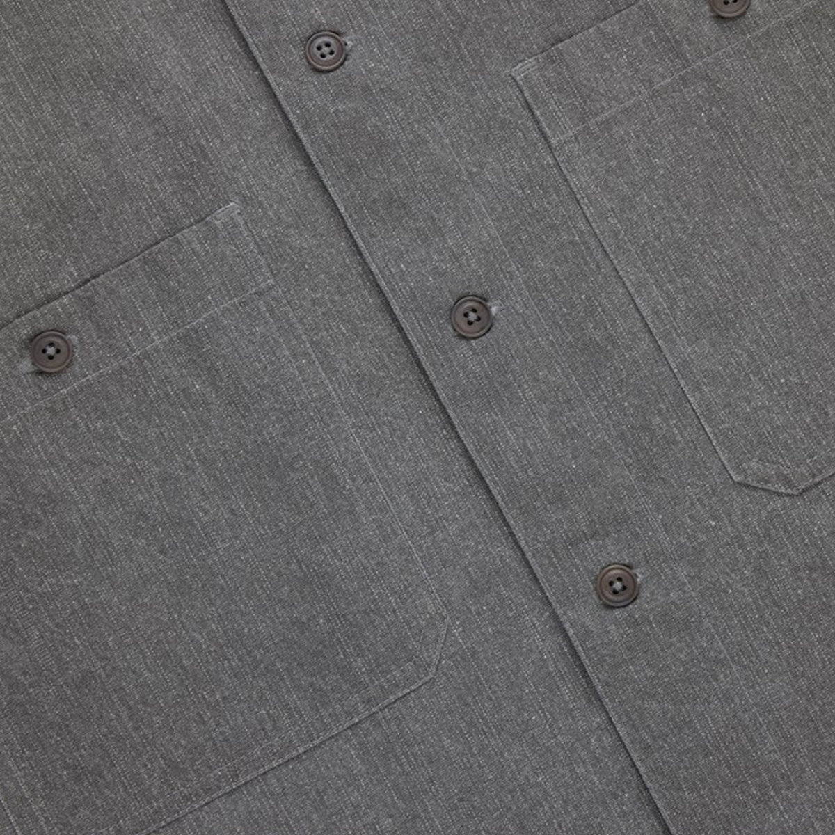 Close-up of a gray shirt with button details