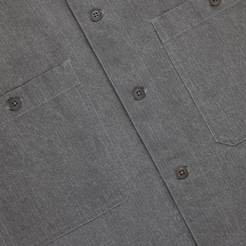 Close-up of a gray shirt with button details