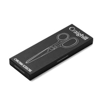 Black box with white text and a graphic of scissors on a white background