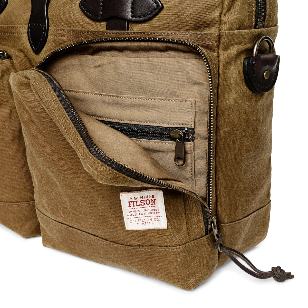Brown briefcase with a visible Filson label on a white background