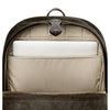 Backpack with a compartment holding a white laptop on a white background