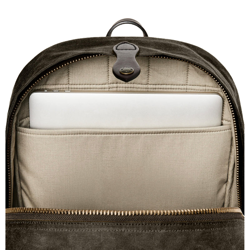 Backpack with a compartment holding a white laptop on a white background
