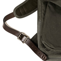 Green backpack with a brown leather strap and buckle on a white background