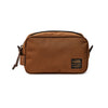 Brown toiletry bag with Filson logo on a white background