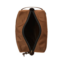 Brown toiletry bag with open zipper on a white background