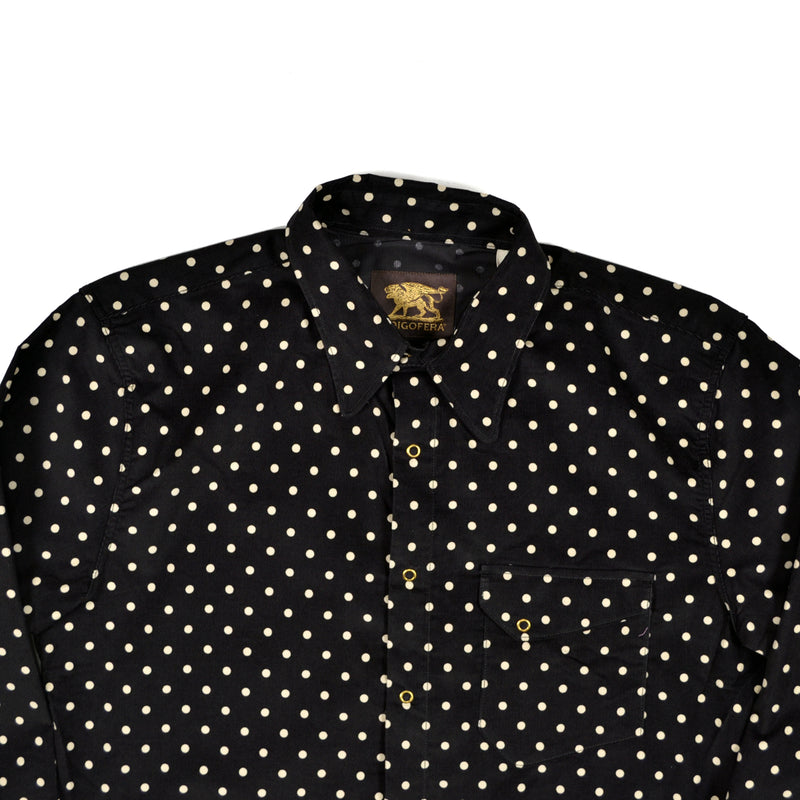 Black shirt with white polka dot pattern on a white background
