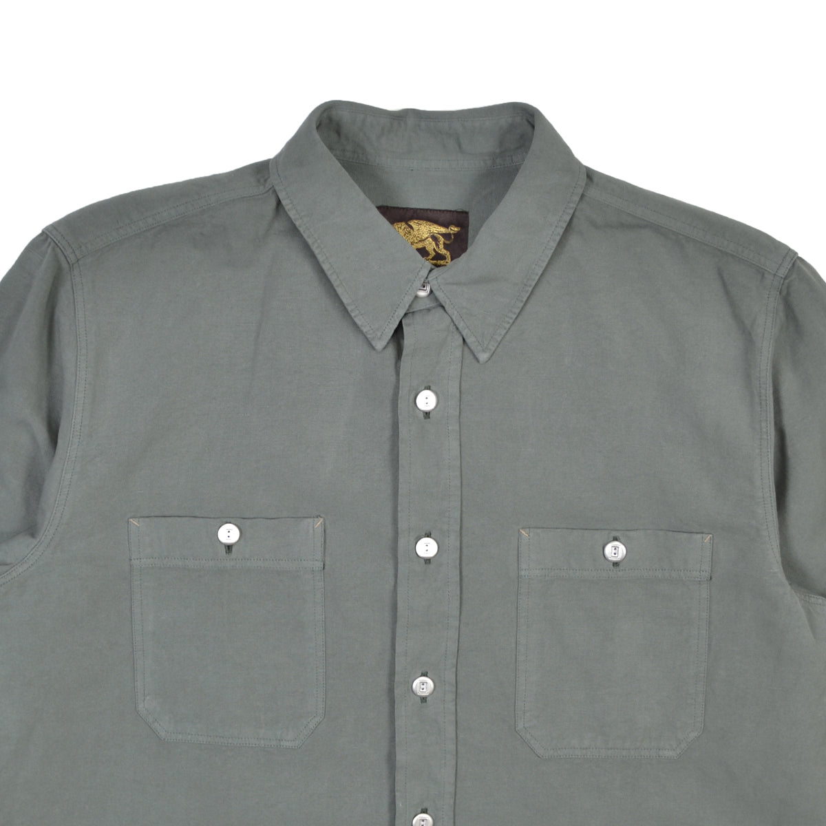 Sage green shirt with two front pockets and a collar on a white background
