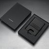 Black wallet and cardholder set with 'JAMES' branding on a gray background