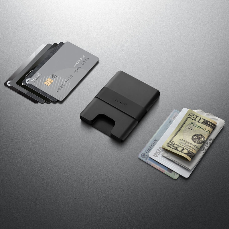 Black cardholder with cards and money on a gray background