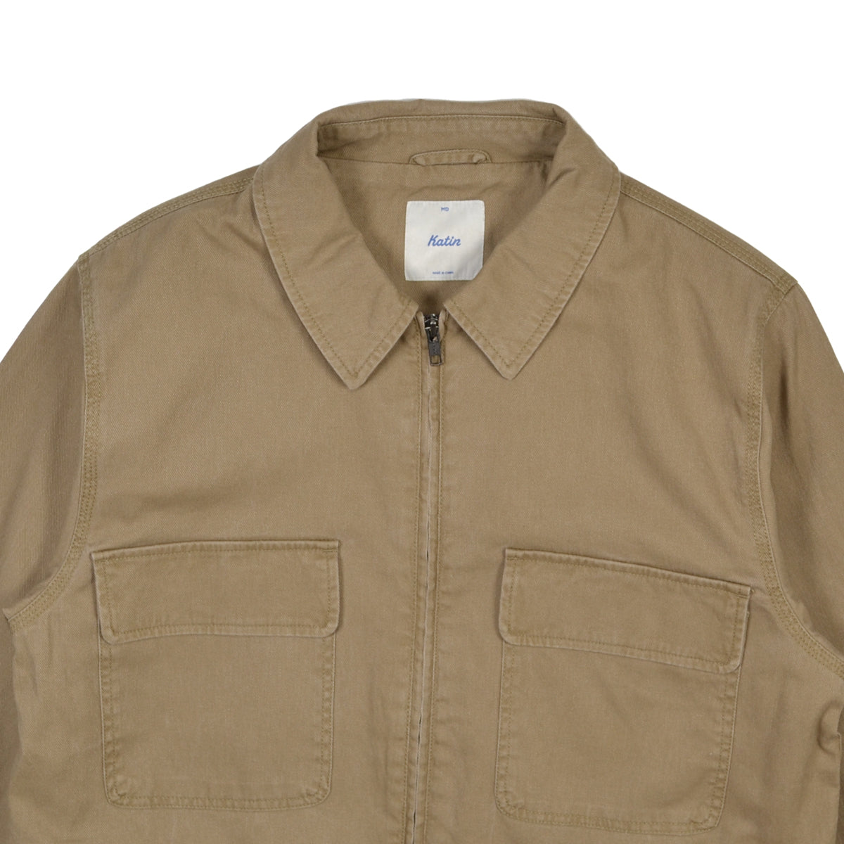 Brown jacket with two front pockets on a white background