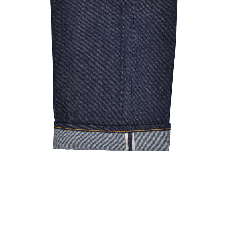 Close-up of a blue denim fabric with a white stripe on a white background