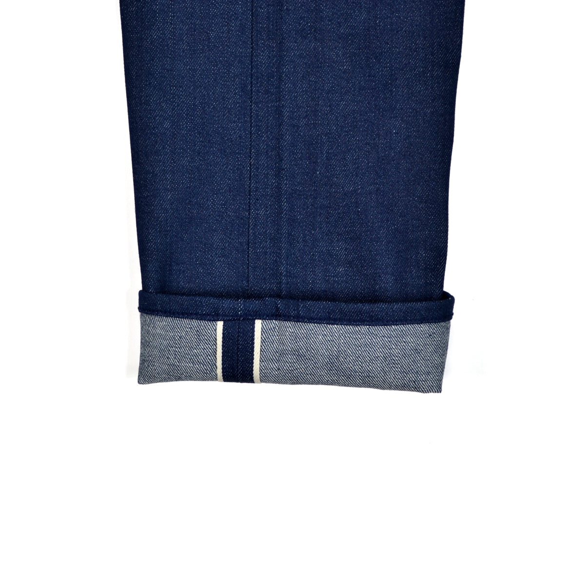 Close-up of blue denim fabric with a white background