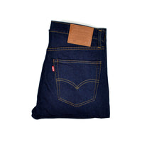 Folded pair of Levi's blue jeans with a Levi's tag on a white background