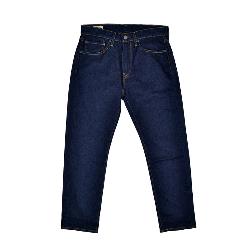 Pair of dark Levi's blue jeans on a white background