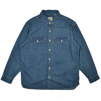 Blue denim shirt with two chest pockets on a white background