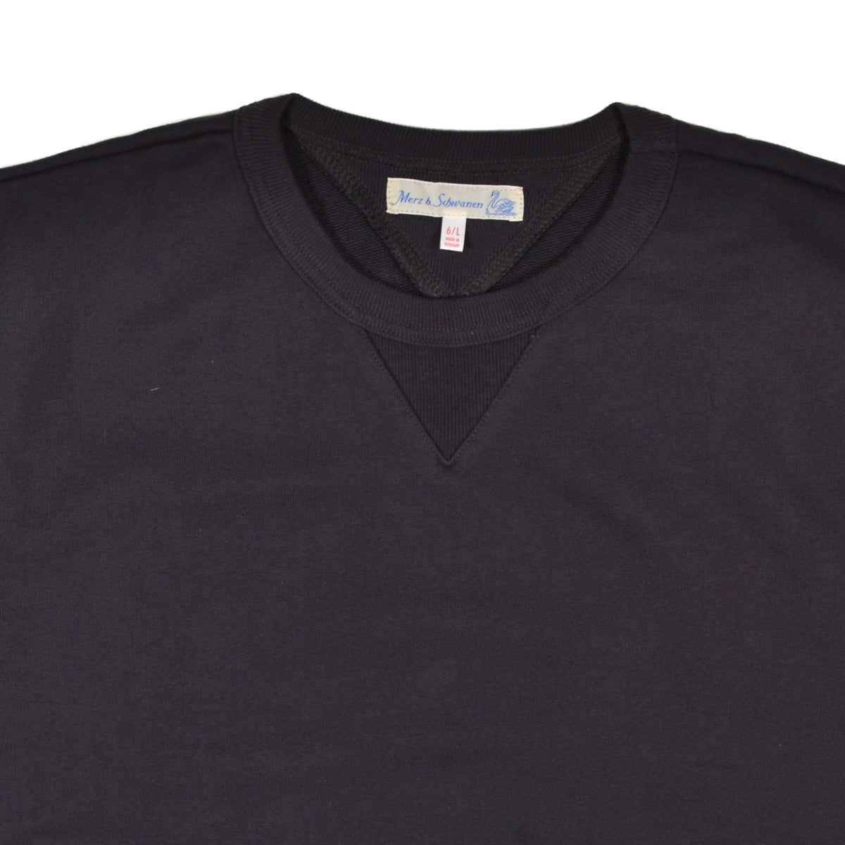 Black sweatshirt with a brand label on a white background