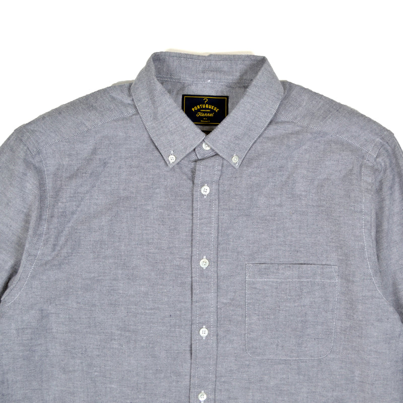 Gray checkered shirt with a brand label on a white background