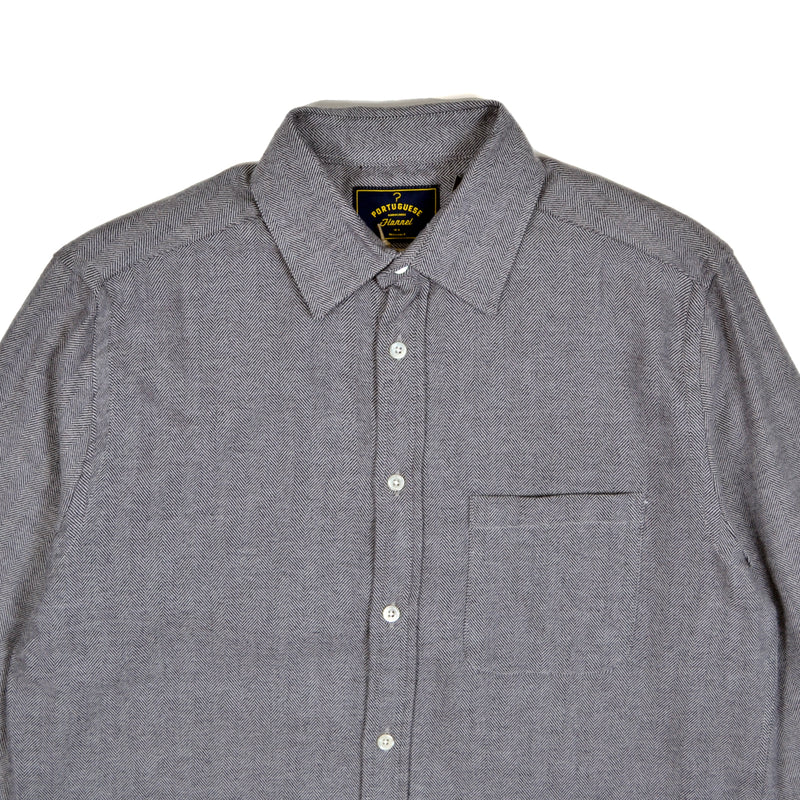 Gray button-up shirt with a collar on a white background