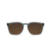 Sunglasses with brown lenses and gray frames on a white background