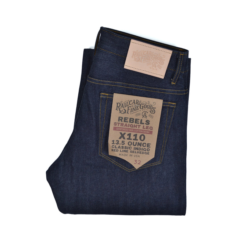 Folded pair of jeans with a brand label on a white background