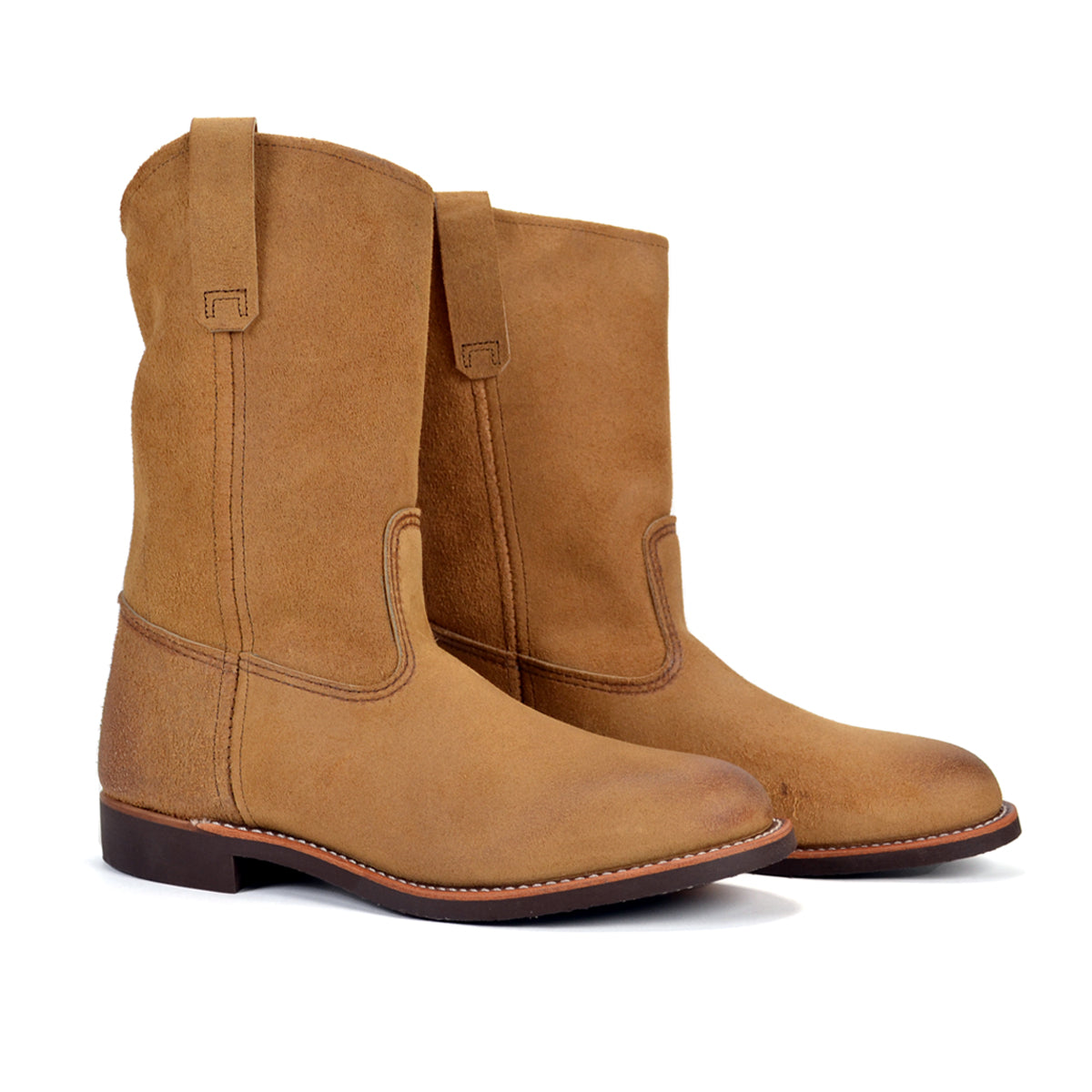 Pair of brown boots on a white background