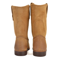 Pair of brown boots on a white background