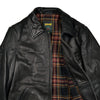 Black leather jacket with plaid lining and Schott logo on a white background