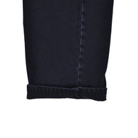 Close-up of a black denim skirt on a white background