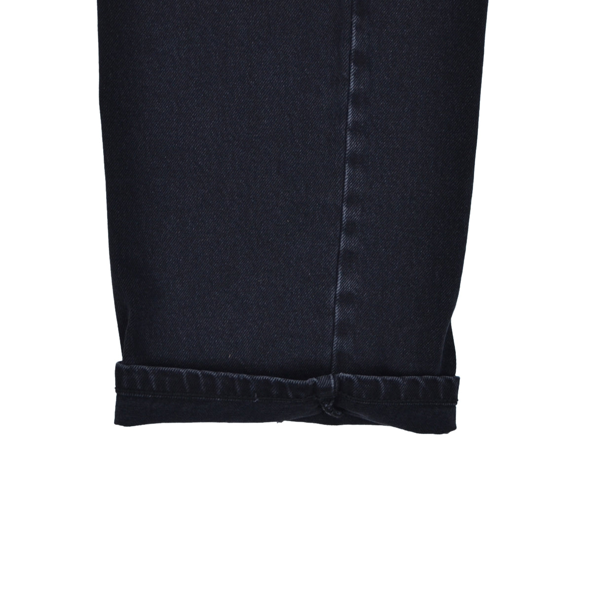 Close-up of a black denim skirt on a white background