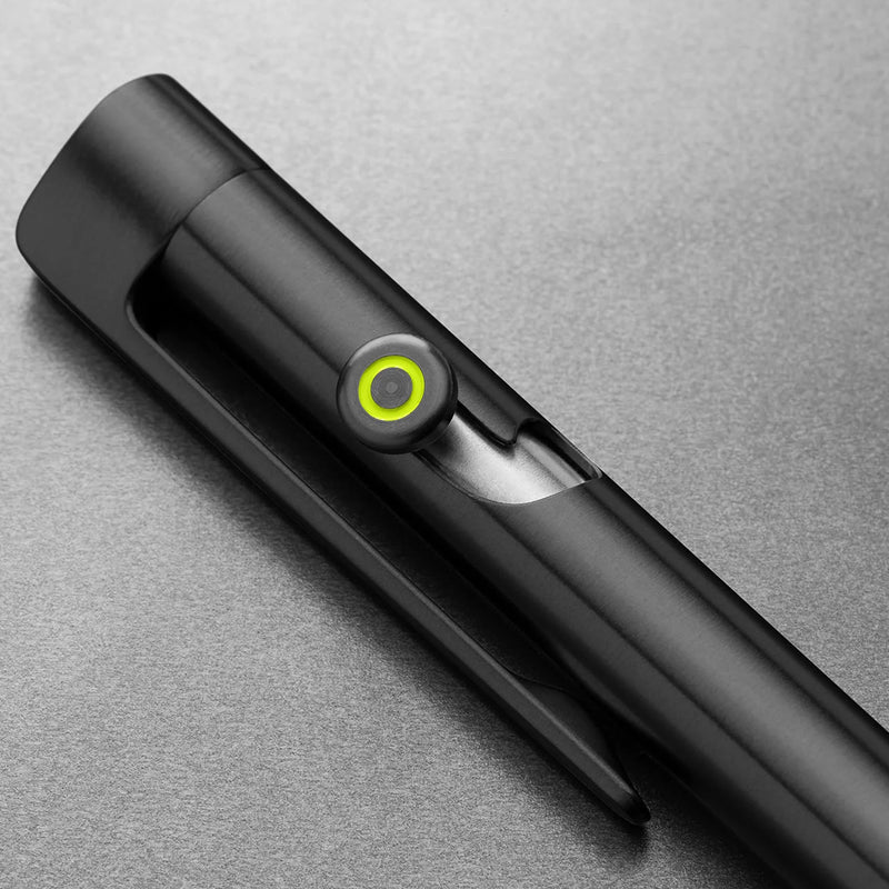 Black pen with a green light on a gray background