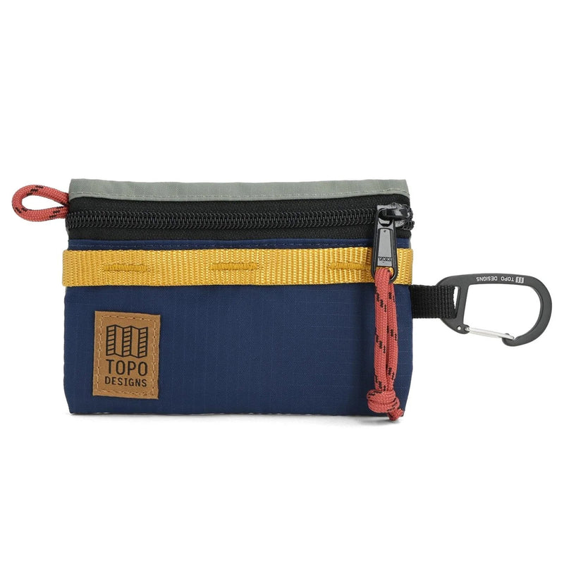 Multicolored small pouch with a carabiner and Topo Designs logo on a white background