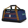 Blue duffel bag with brown straps on a white background