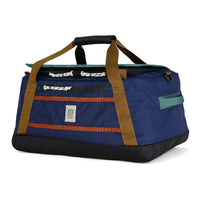 Blue duffel bag with brown straps on a white background