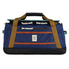 Blue duffel bag with brown straps and a Topo Designs logo on a white background