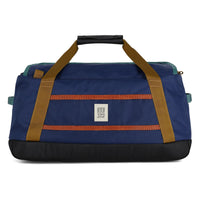 Blue duffel bag with brown straps on a white background