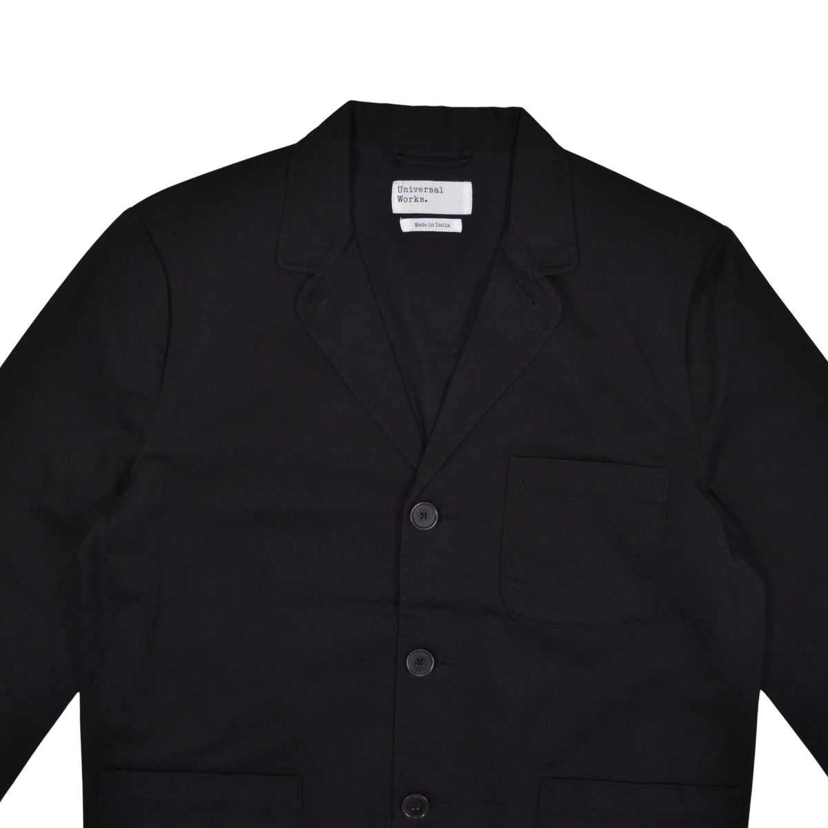 A black wool-blend utility jacket with notch lapels, a three-button front closure, and a single chest pocket, laid flat against a light gray background.