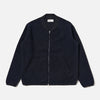 Navy blue zip-up jacket on a light gray background