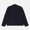 Dark blue sweater on a light gray background