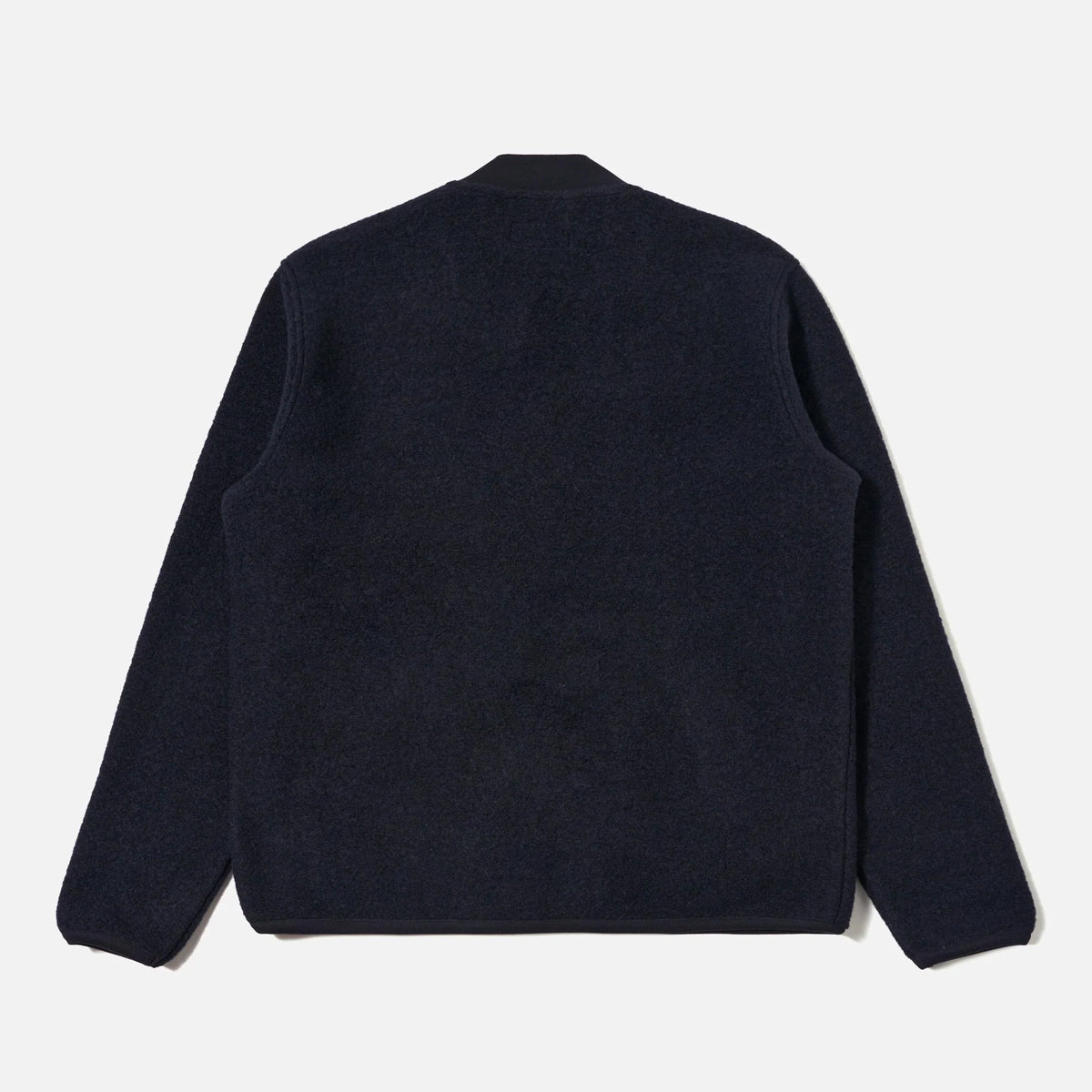 Dark blue sweater on a light gray background