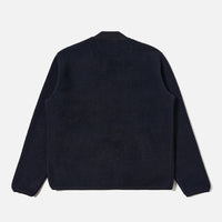 Dark blue sweater on a light gray background