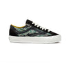 Black sneaker with green camouflage pattern on a white background